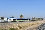 A San Bernardino-Downtown Station bound train approaches San Bernardino Tippercanoe Station 